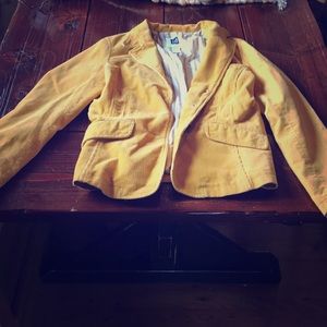 Gold colored corduroy blazer.
